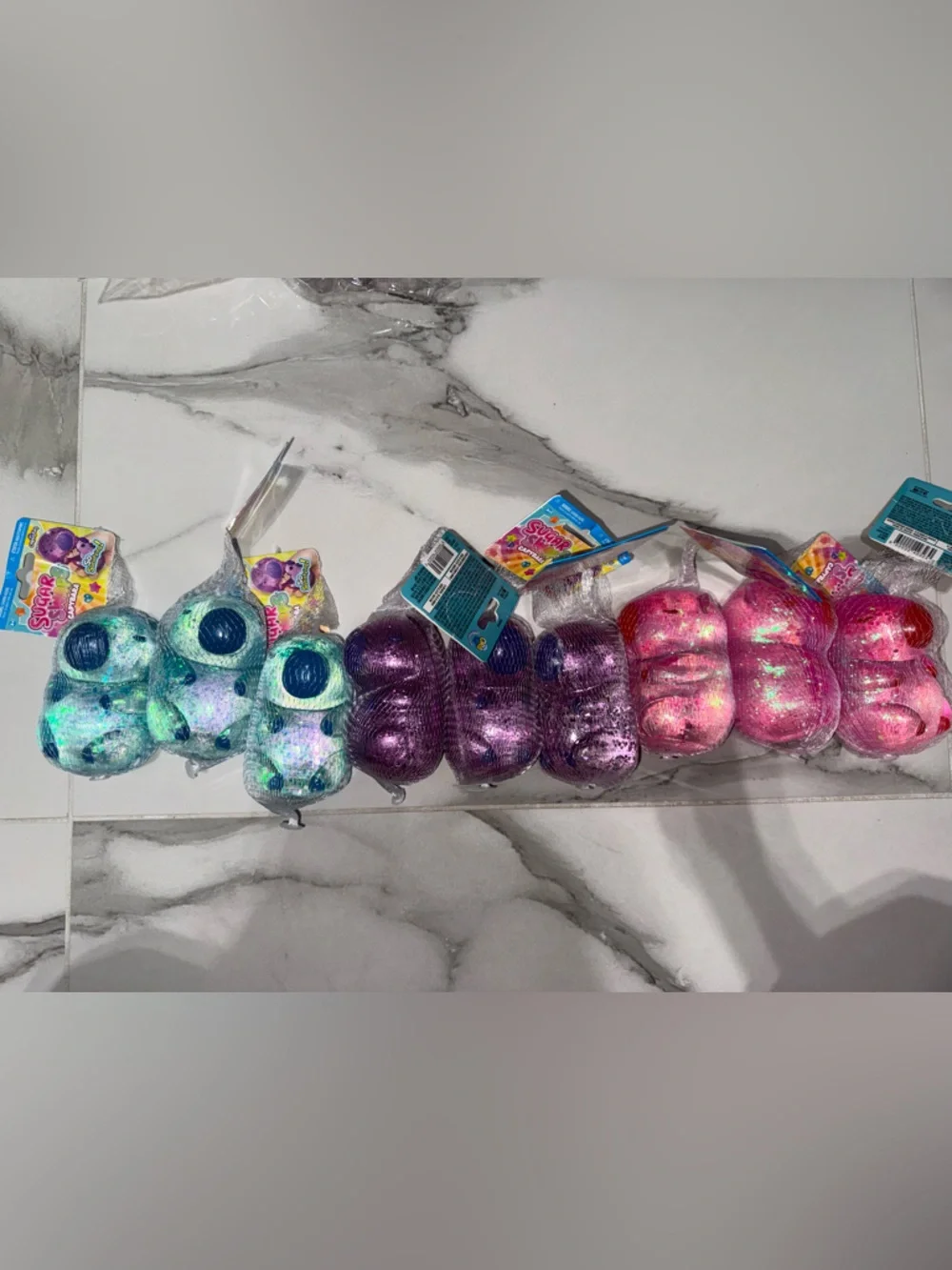 Sugar swaps Glitter Squishes capybaras  - Blue, Purple & Pink Sensory Toy